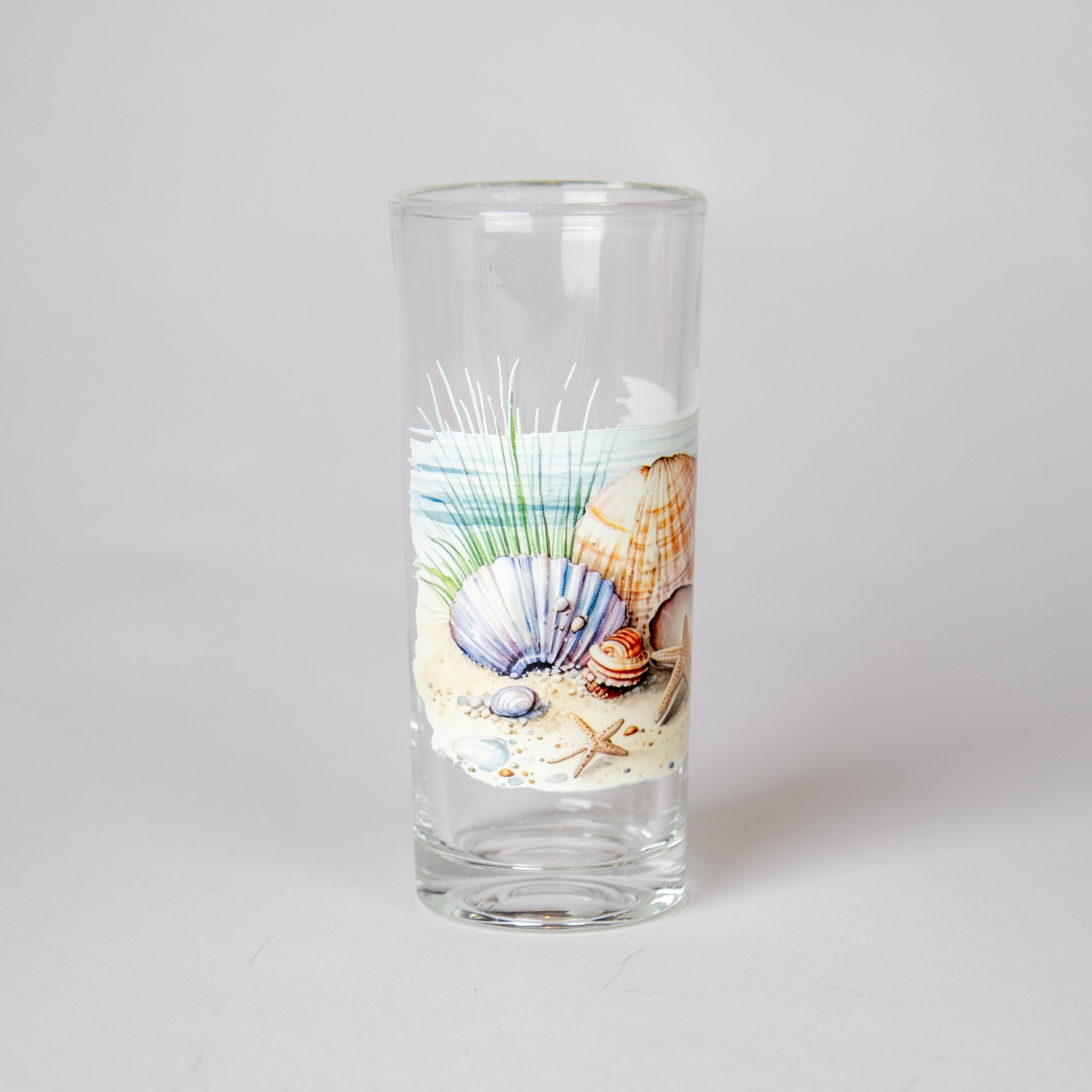 كأس زجاجي برسمة الصدف