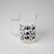 كوب زجاجي بمسكة